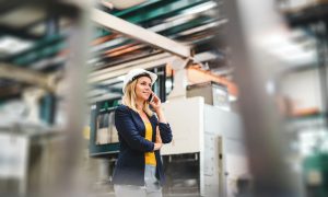 A professional woman in a manufacturing plant