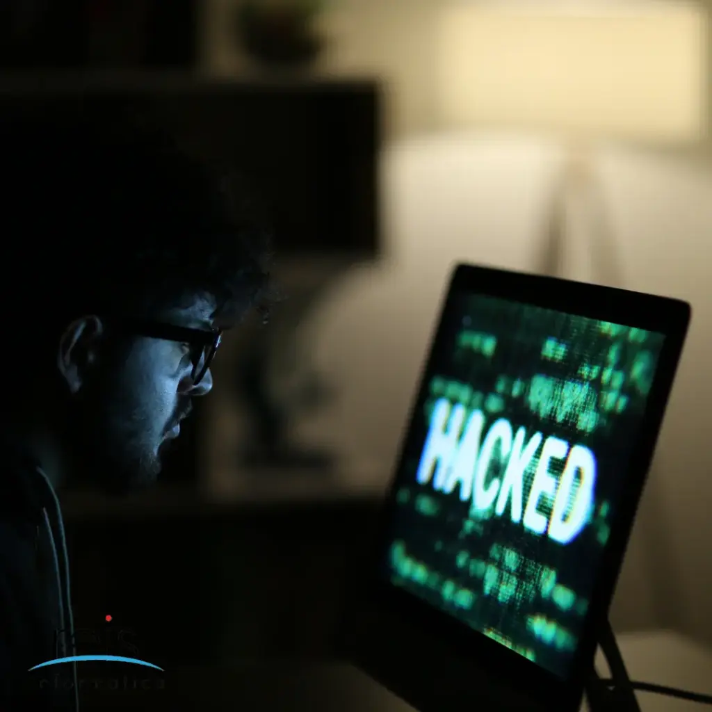 Reis Informática cybersecurity alert: hacked computer screen signaling data breach and digital security threat
