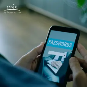 Person holding a smartphone displaying a password login screen with the word ‘Passwords,’ representing mobile account security and password management.