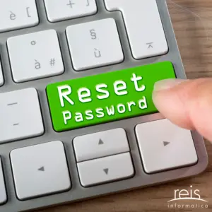 Close-up of a computer keyboard with a green ‘Reset Password’ key being pressed, representing password recovery and account security